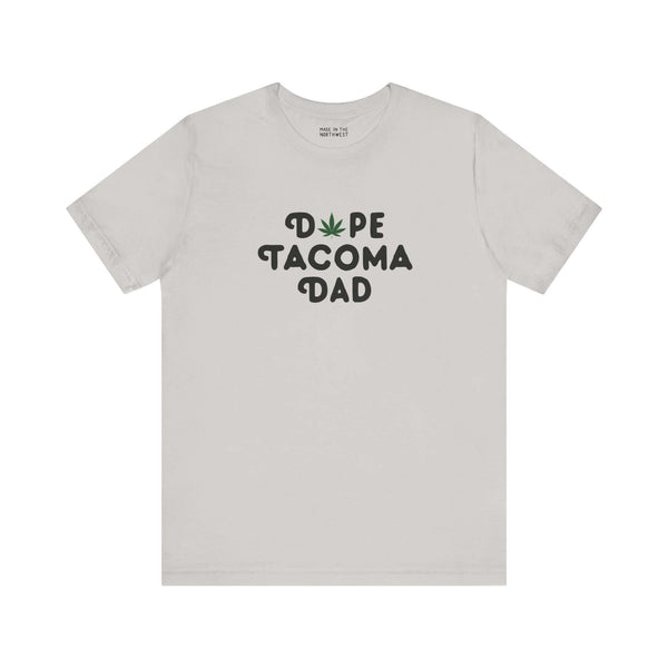 Dope Tacoma Dad soft tee featuring a playful marijuana leaf in place of the 'O', ideal for cool dads.