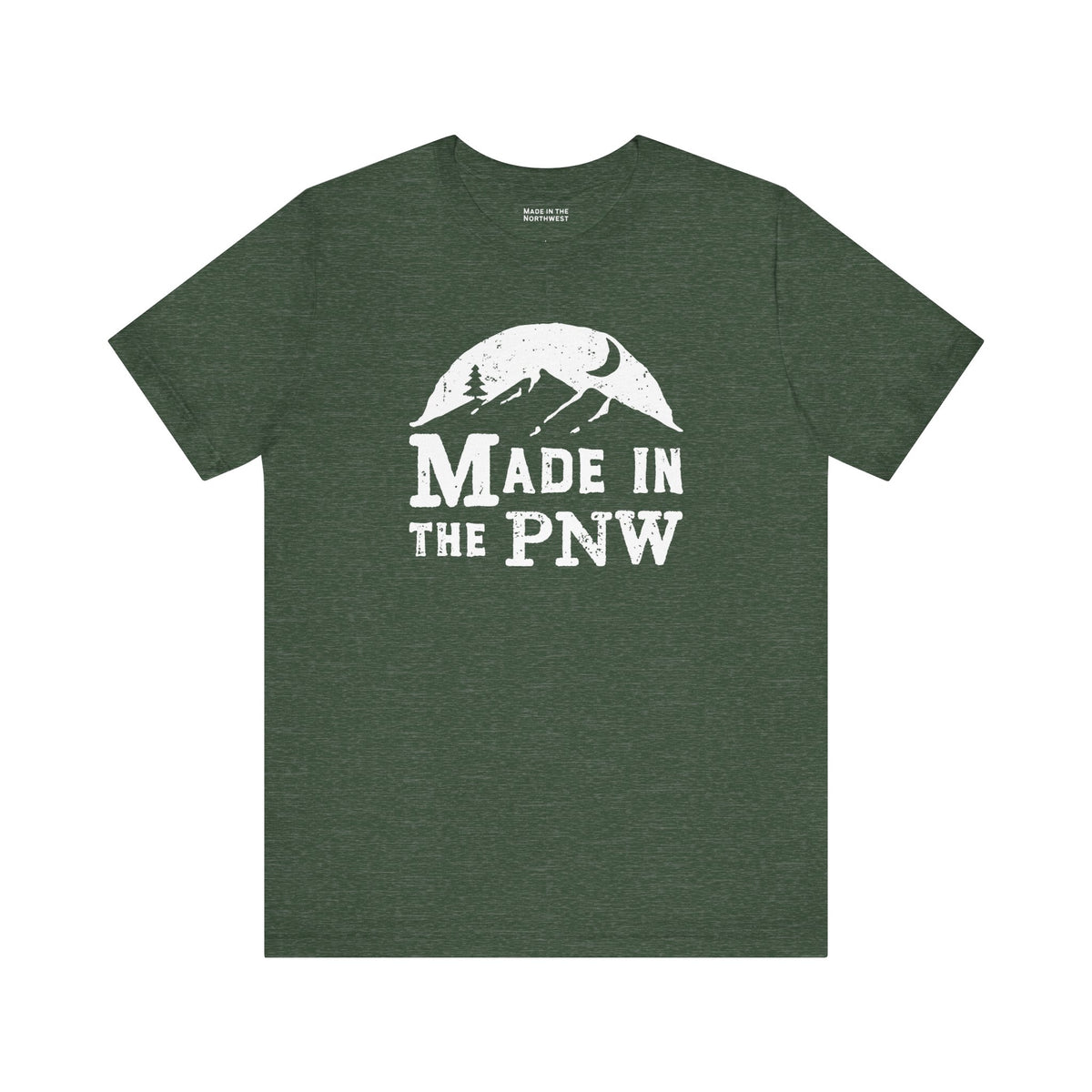Made in the PNW T shirt with distressed mountain graphic on a green background.