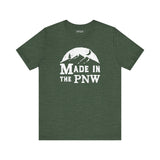 Made in the PNW T shirt with distressed mountain graphic on a green background.