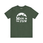 Made in the PNW T shirt with distressed mountain graphic on a green background.