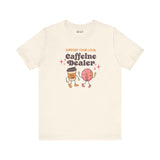 Support Your Local Caffeine Dealer premium soft tee featuring playful coffee and donut characters.