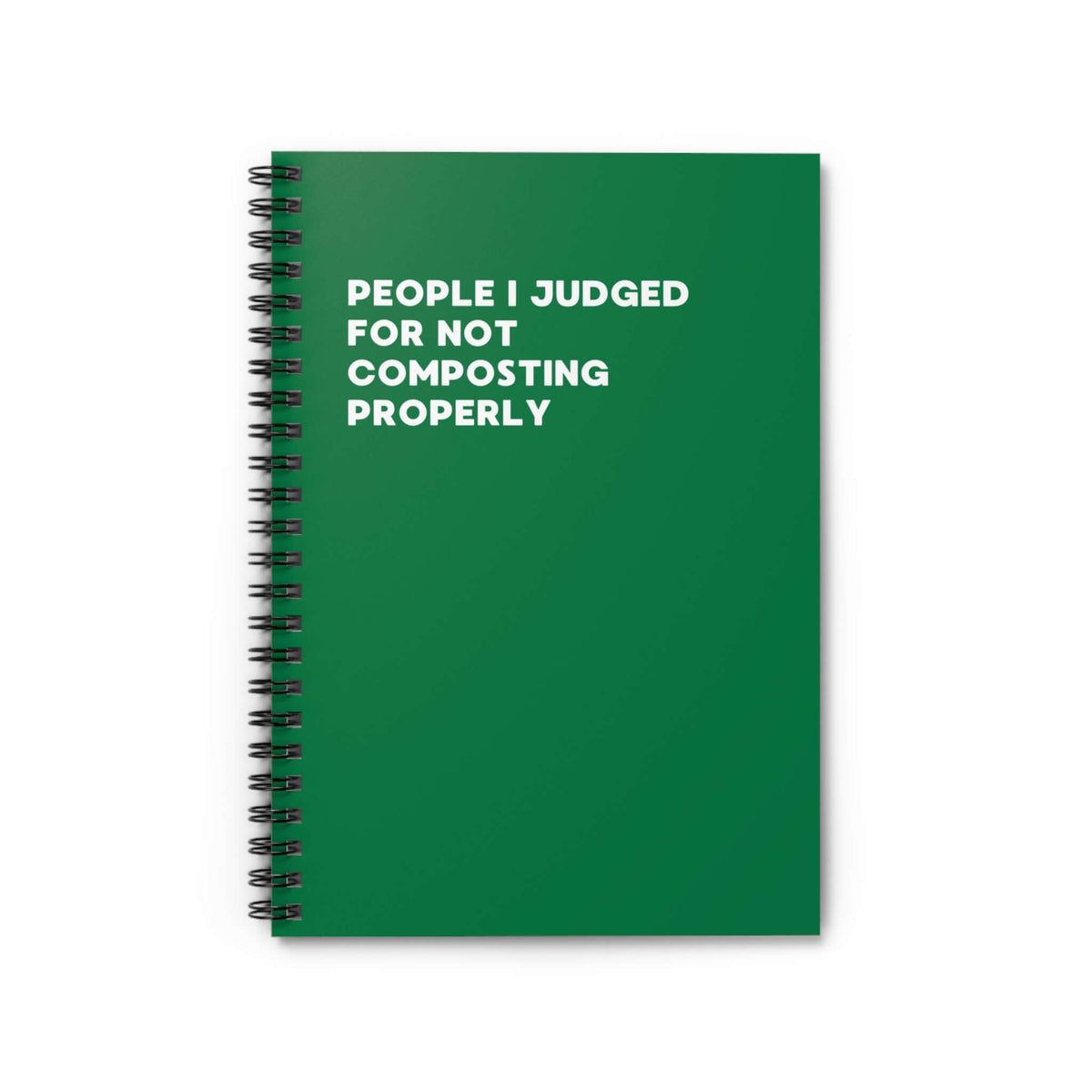 Green spiral notebook titled 'People I Judged for Not Composting Properly' for eco-friendly journaling.