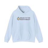 Light blue Made in the Northwest Hoodie featuring a compass logo, perfect for showcasing Pacific Northwest pride.