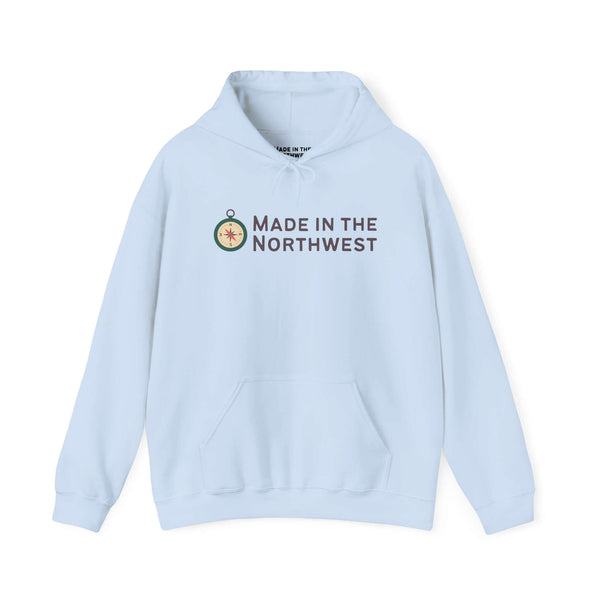 Light blue Made in the Northwest Hoodie featuring a compass logo, perfect for showcasing Pacific Northwest pride.