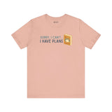 Peach soft tee with 'Sorry I Can't - I Have Plans' design, perfect for book lovers and camping enthusiasts.