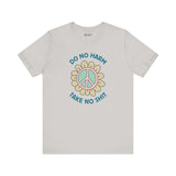 Do No Harm, Take No Sh!t premium soft tee with peace flower graphic, promoting kindness and strength.