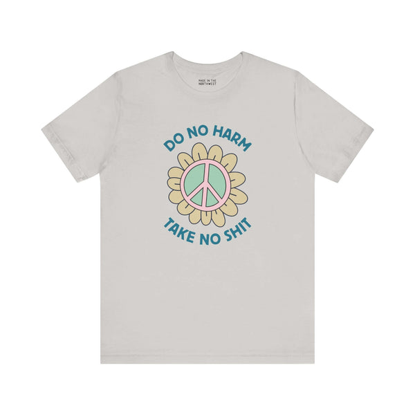 Do No Harm, Take No Sh!t premium soft tee with peace flower graphic, promoting kindness and strength.