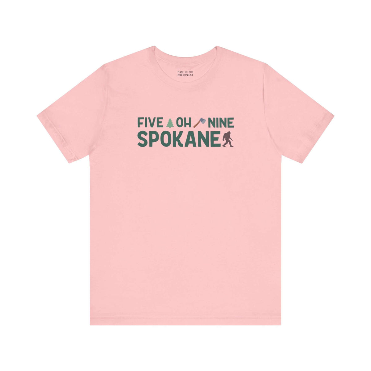 Pink "Five Oh Nine Spokane" tee with axe and tree design, celebrating Spokane pride and local charm.