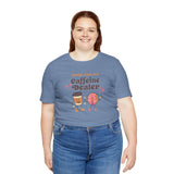 Support Your Local Caffeine Dealer coffee soft tee in blue, featuring playful graphics of coffee cups and pastries.