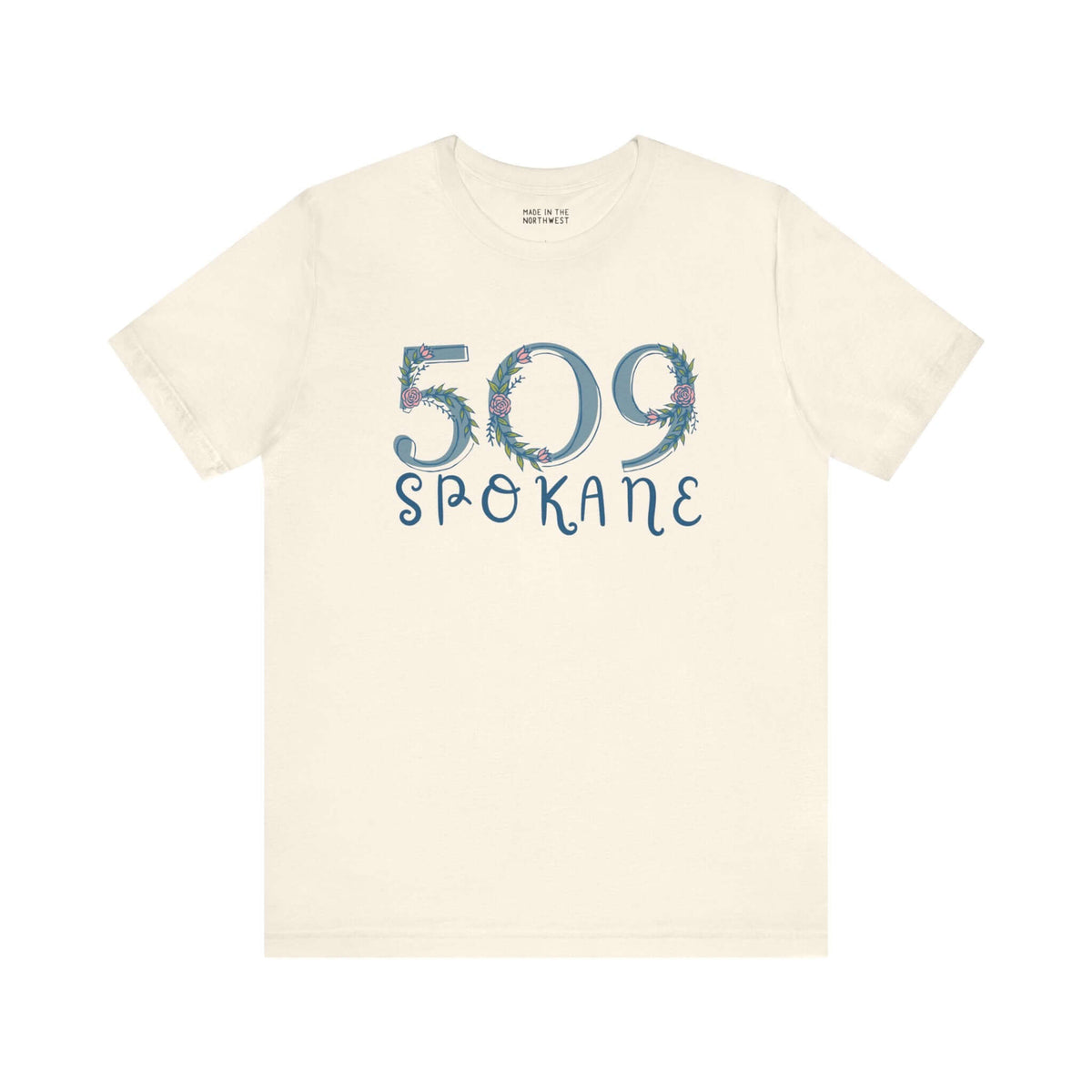 Beige tee featuring 509 Spokane floral design showcasing Pacific Northwest pride.