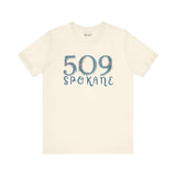 Beige tee featuring 509 Spokane floral design showcasing Pacific Northwest pride.