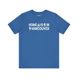 Home Is in Vancouver Tee featuring campfire, Bigfoot, and tree design on a blue shirt.