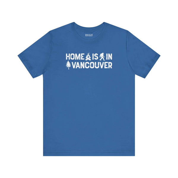Home Is in Vancouver Tee featuring campfire, Bigfoot, and tree design on a blue shirt.
