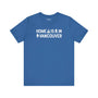 Home Is in Vancouver Tee featuring campfire, Bigfoot, and tree design on a blue shirt.