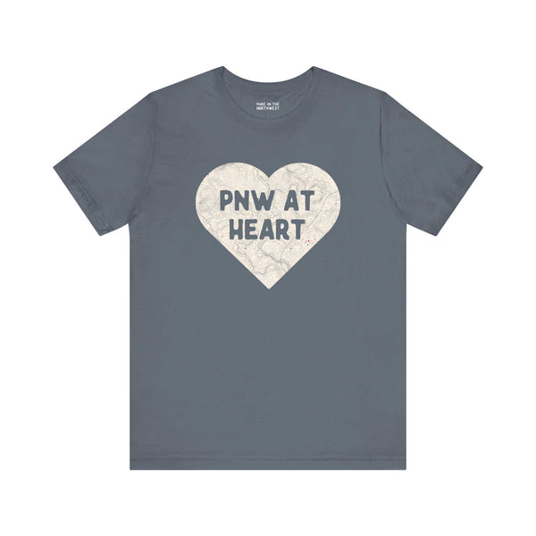 Gray t-shirt with heart-shaped map print and "PNW at Heart" text, showcasing Pacific Northwest pride.