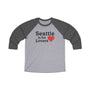 Gray and black raglan tee with "Seattle is for Lovers" print, featuring a red heart, representing Seattle's charm and allure.