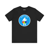 Black tee with Bigfoot in a rainbow tutu and crown, celebrating Pride with a cheerful design.