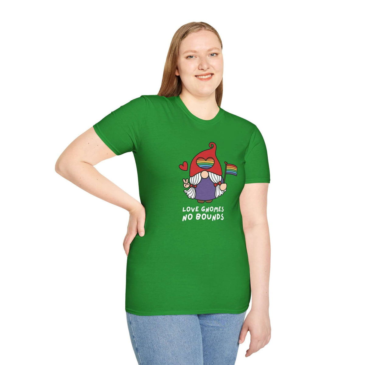 Model wearing a green Love Gnomes No Bounds T-shirt with a gnome holding a rainbow flag, promoting love and inclusivity.