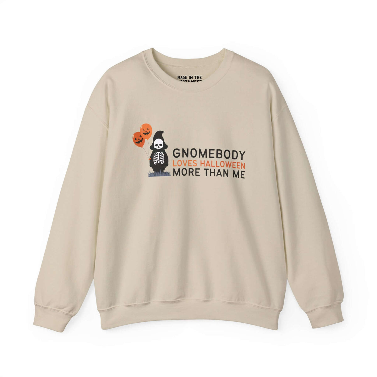 Halloween sweatshirt with skeleton gnome and balloons, text "Gnomebody Loves Halloween More Than Me," on a beige background.