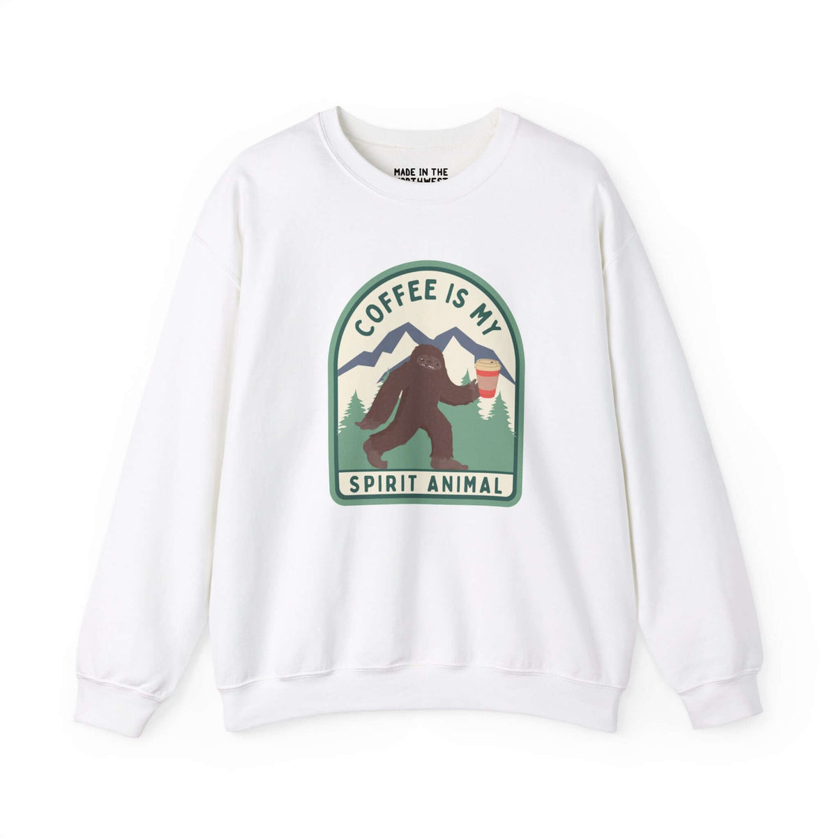 White sweatshirt featuring "Coffee Is My Spirit Animal" with Sasquatch holding a coffee cup, perfect for coffee lovers.