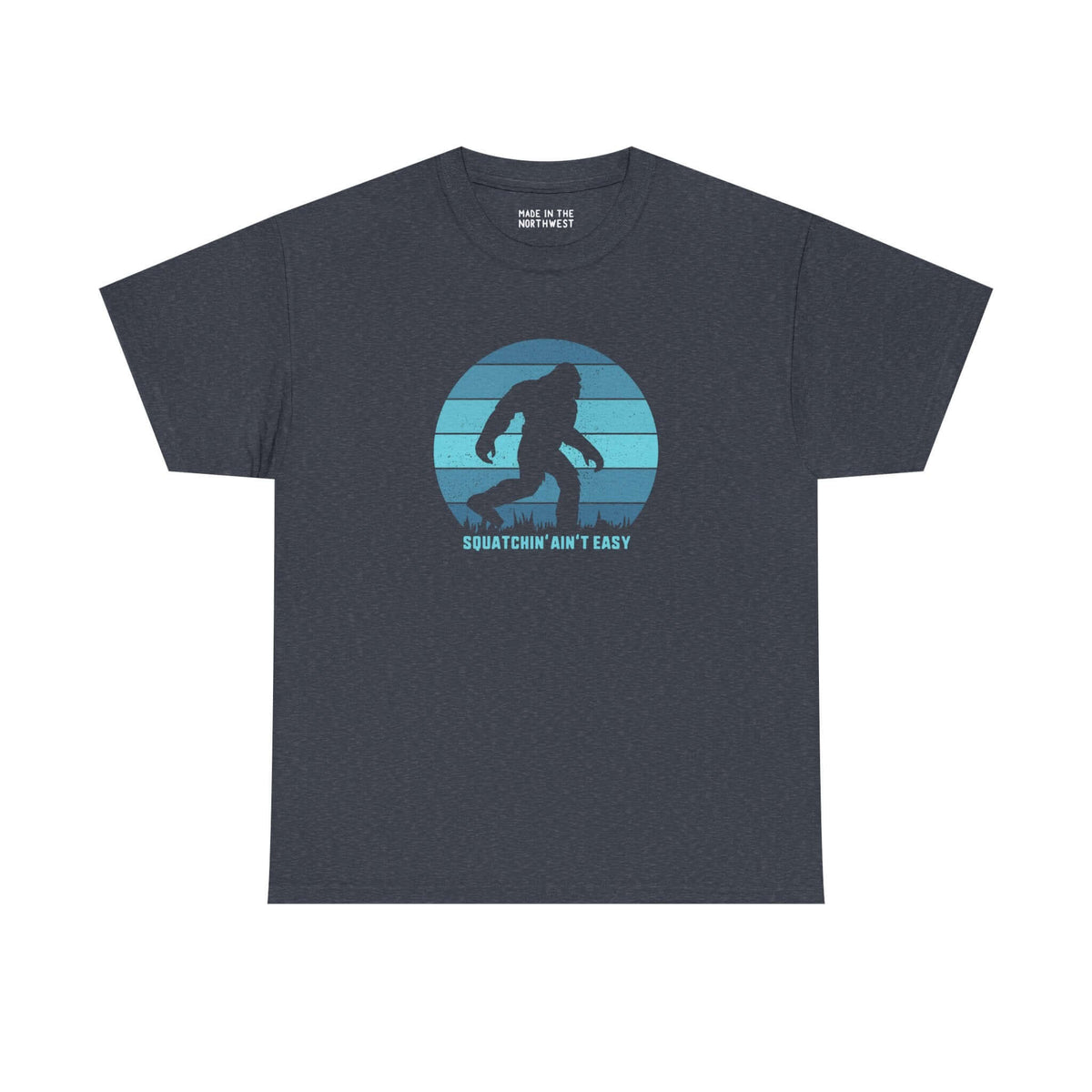 Squatchin' Ain't Easy athletic tee featuring Bigfoot silhouette on a blue circular design.