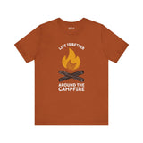 Premium soft tee in rust color with campfire graphic and text 'Life is Better Around the Campfire'.