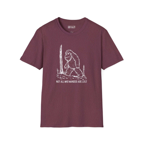 Bigfoot graphic t-shirt featuring the phrase 'Not All Who Wander Are Lost' in maroon color.