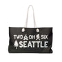Two Oh Six Roots Seattle Adventure Weekender Bag featuring axe and tree design, perfect for adventures.