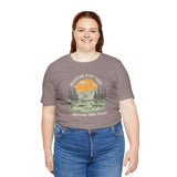 Woman wearing Adventure Is Out There... And So Are Serial Killers soft tee, perfect for outdoor and true crime fans.