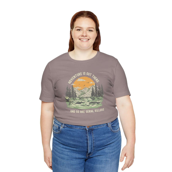 Woman wearing Adventure Is Out There... And So Are Serial Killers soft tee, perfect for outdoor and true crime fans.