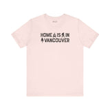 Home Is in Vancouver Tee featuring campfire, Bigfoot, and tree graphics, showcasing PNW Couve Pride.