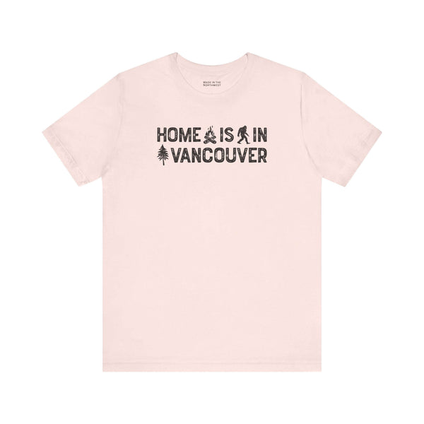 Home Is in Vancouver Tee featuring campfire, Bigfoot, and tree graphics, showcasing PNW Couve Pride.