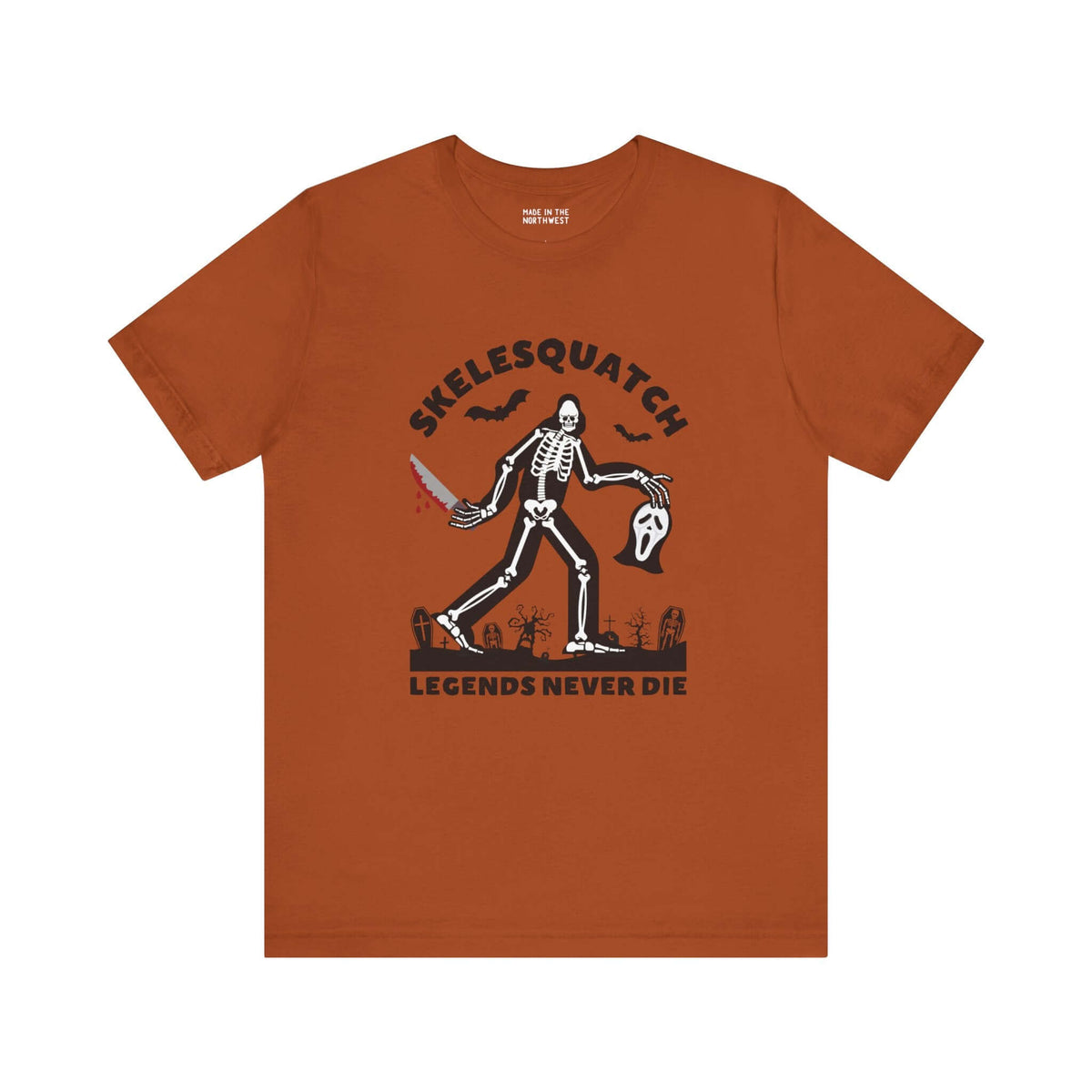 Skelesquatch Halloween soft tee with skeleton sasquatch, bloody knife, and Scream mask design, perfect for horror and cryptid fans.