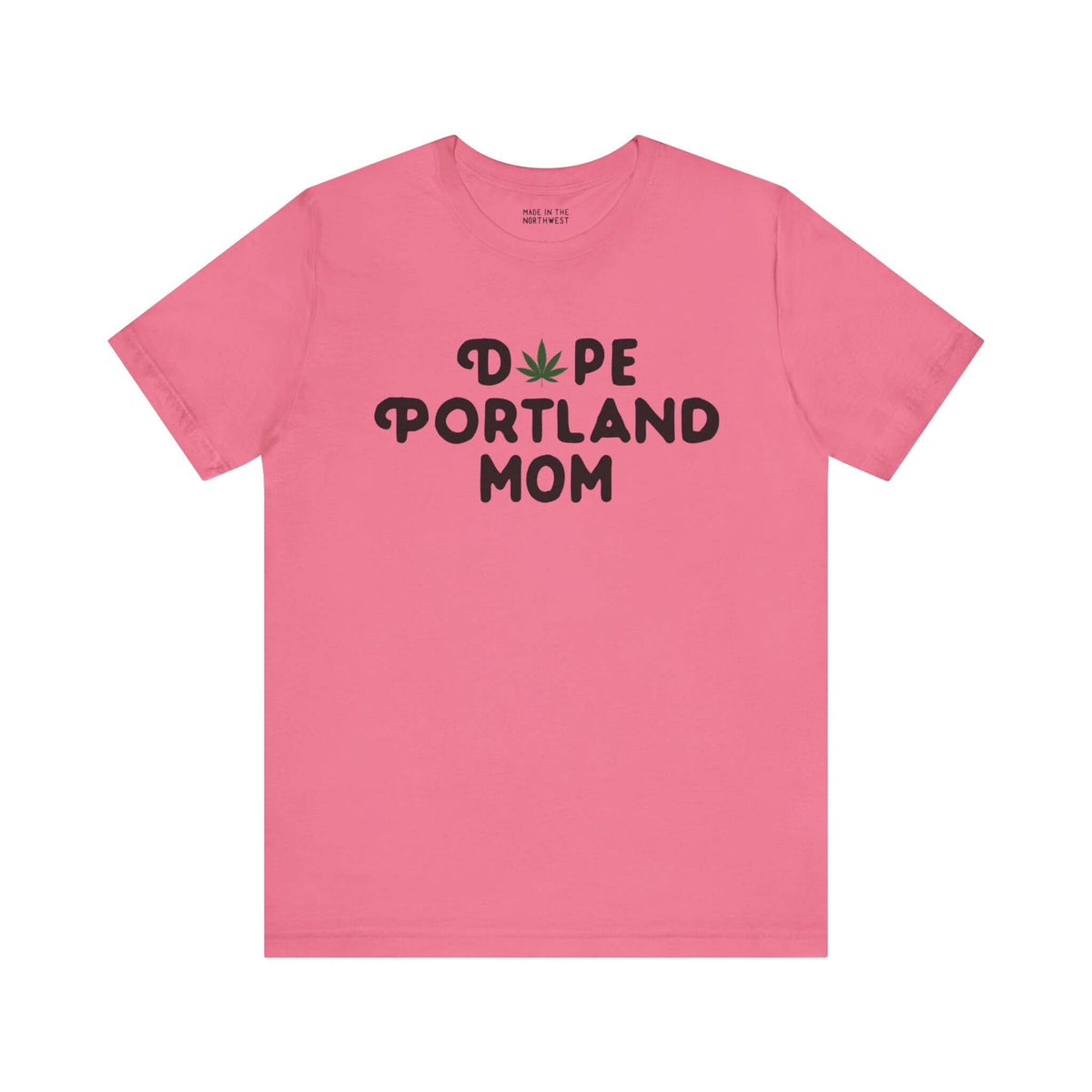 Pink tee with "Dope Portland Mom" text, featuring marijuana leaf design replacing the "O" in "Dope", celebrating Portland's vibrant spirit.