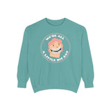 We're All A Little Bit Gay sweatshirt in teal with playful graphic design featuring a smiling face.