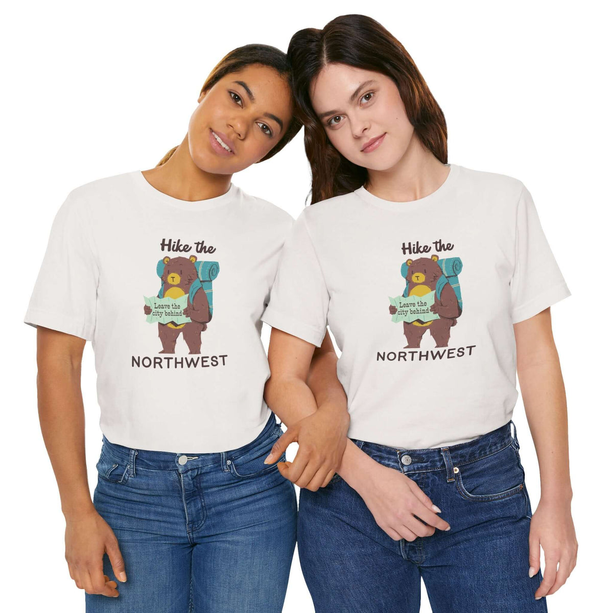Two models wearing Hike the Northwest t shirt featuring a bear with a backpack and map, perfect for outdoor adventures.