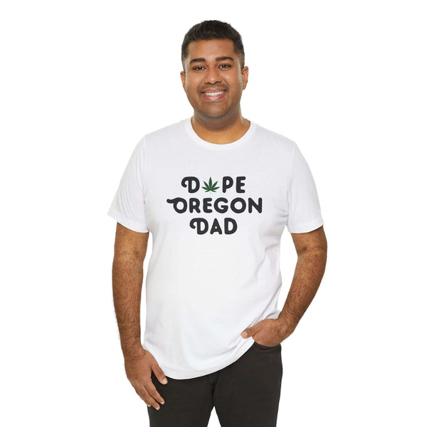 Man wearing 'Dope Oregon Dad' tee with marijuana leaf design, showcasing Oregon pride and laid-back style.