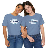Two women wearing love always wins t shirt in blue, showcasing bold and colorful typography celebrating love.