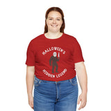 Halloween's Hidden Legend Bigfoot tee featuring creature with knife in spooky design, perfect for Halloween lovers.