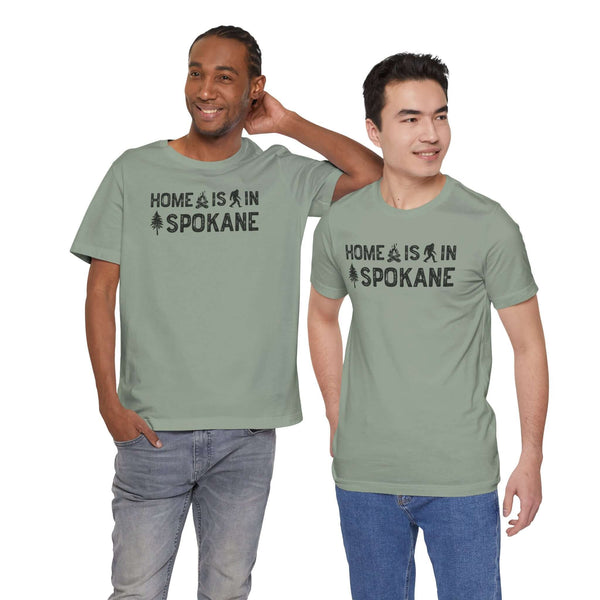 Home Is in Spokane Tee worn by two men, showcasing Spokane pride and outdoor symbols.