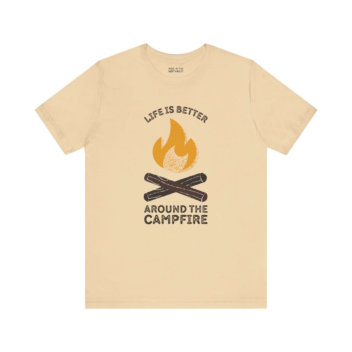 Cozy Campfire Chronicles premium soft tee in beige, featuring campfire design and quote, perfect for outdoor lovers.