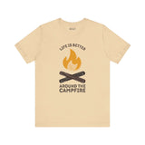 Cozy Campfire Chronicles premium soft tee in beige, featuring campfire design and quote, perfect for outdoor lovers.