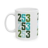 Two-Five-Three Pop Tacoma ceramic mug with vibrant stacked area code design in green and blue.