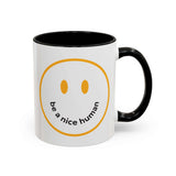 Be a Nice Human Mug with a hand-drawn smile and contrasting black handle.