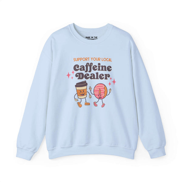 Light blue sweatshirt with "Support Your Local Caffeine Dealer" text and playful coffee cup and donut graphic.