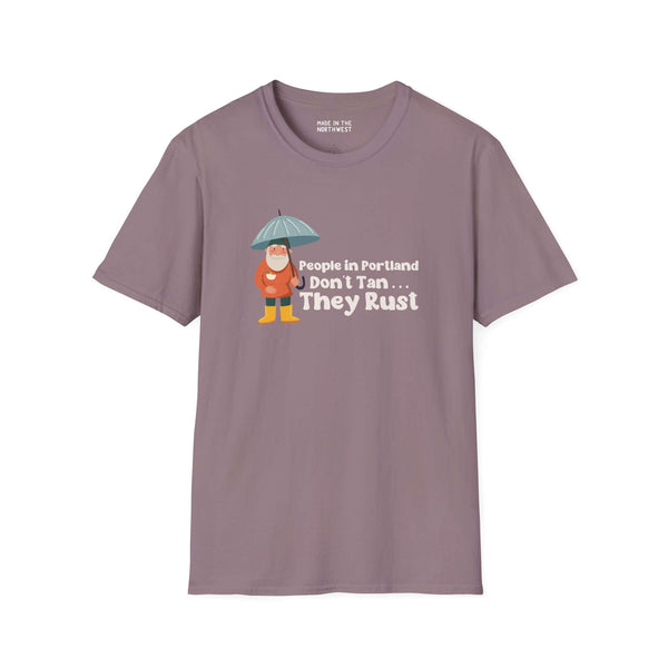 People in Portland Don't Tan, They Rust t-shirt with a character holding an umbrella, perfect for Portland locals.