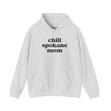 Cozy gray hoodie featuring the text 'chill spokane mom', perfect for laid-back moms who love the outdoors.