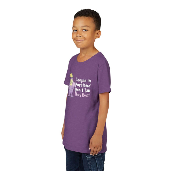 Child wearing a purple 'People in Portland Don't Tan, They Rust' tee, perfect for rainy PNW fun.