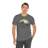 Man wearing Pacific Peaks Modern Circle Soft Tee with mountain scene, perfect for Northwest lovers seeking bold or muted styles.