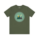 Minimalist forest design tee in green with mountain silhouette, perfect for nature lovers and outdoor enthusiasts.